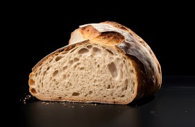 sourdough-bread-with-crispy-crust-wooden-shelf-bakery-goods-traditional-bread-cut-loaf
